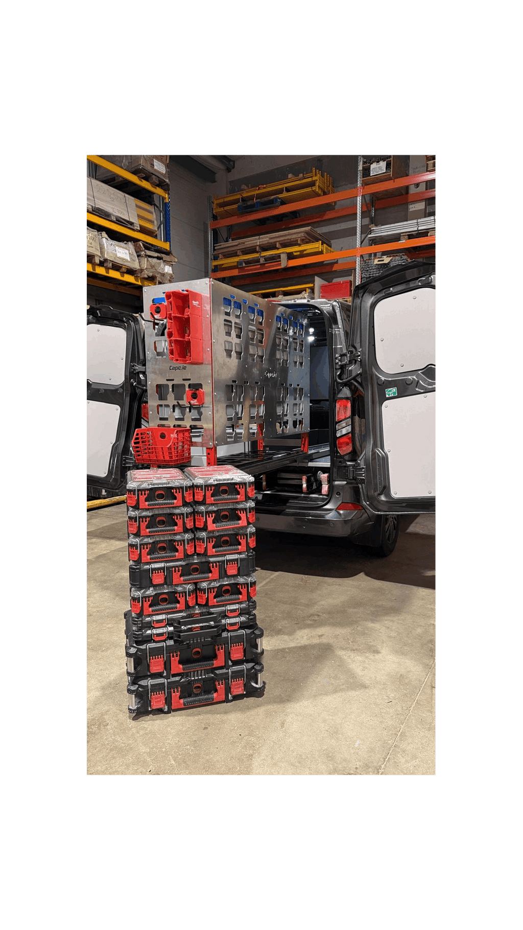 Picture of a Milwaukee Packout Pull Out Shelving Unit in a Van with Milwaukee Packout Accessories clipped onto the Milwaukee Packout Gable with Milwaukee Packout Organisers sitting in front
