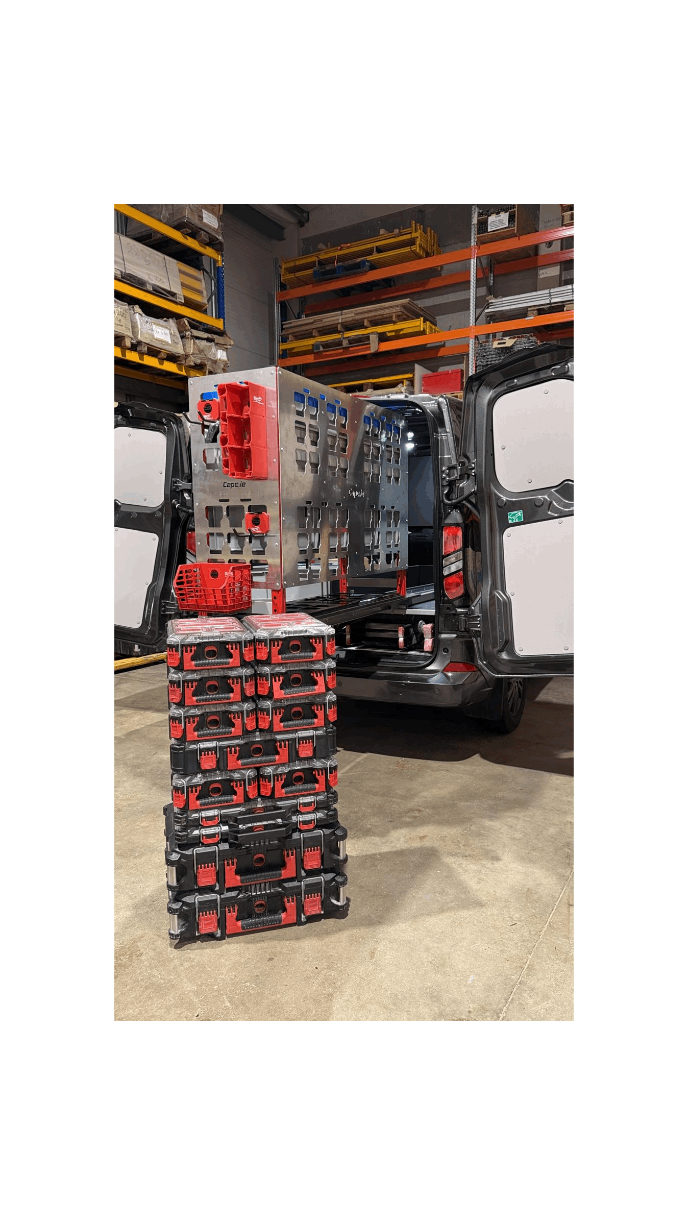 Picture of a Milwaukee Packout Pull Out Shelving Unit in a Van with Milwaukee Packout Accessories clipped onto the Milwaukee Packout Gable with Milwaukee Packout Organisers sitting in front