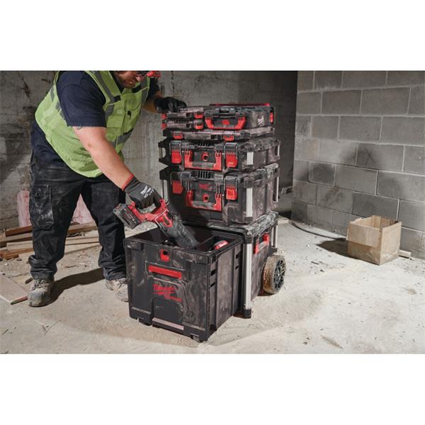 Picture of a Worker putting a Milwaukee Tool into a Milwaukee Packout Rolling Drawer