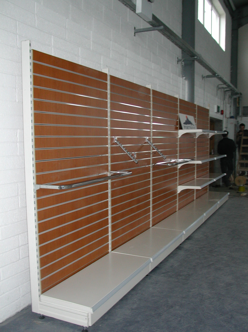 Small Clip that screws onto the back of a Panel to make it compatible with 50mm pitch tegometall shelving.&nbsp;
