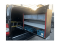 Picture of a Pull Out Shelving Unit in a Van with a Selection of Grey Euro Boxes and a Bin Kit