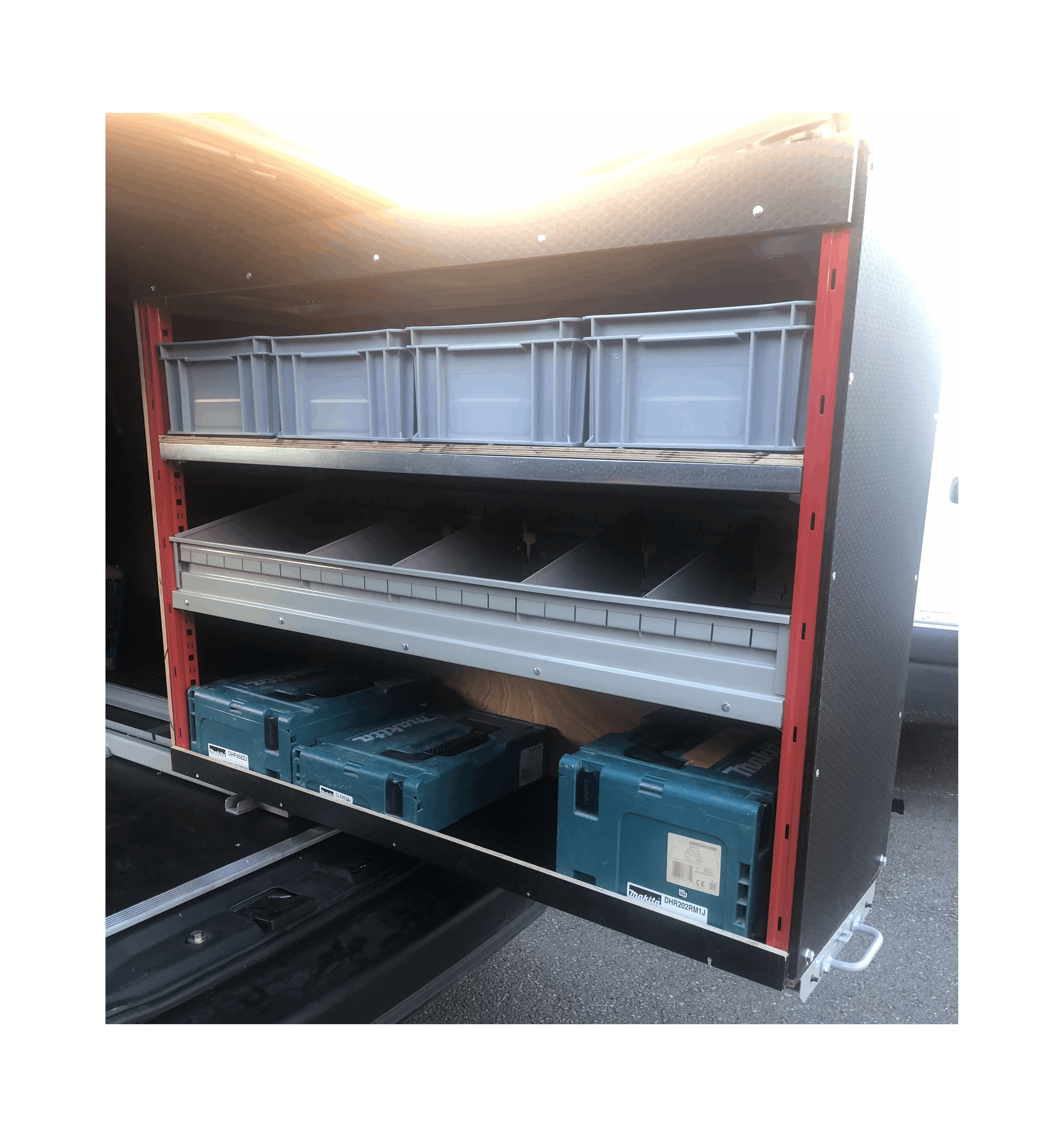 Picture of a Pull Out Shelving Unit in a Van with a Selection of Grey Euro Boxes and a Bin Kit